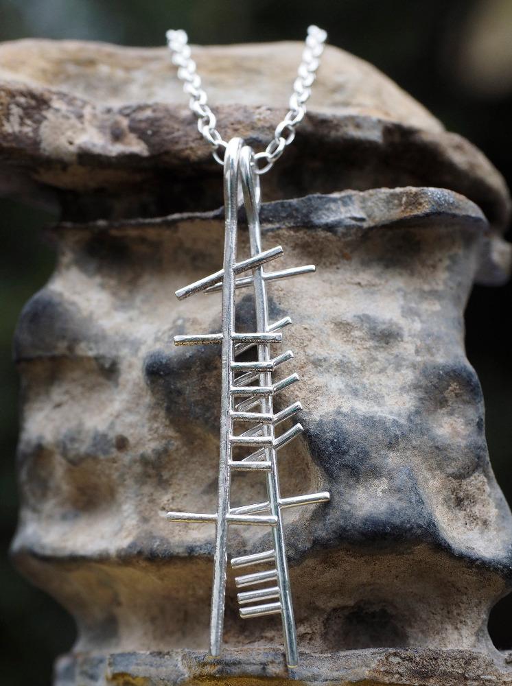 Anam Cara Double pendant on a stone