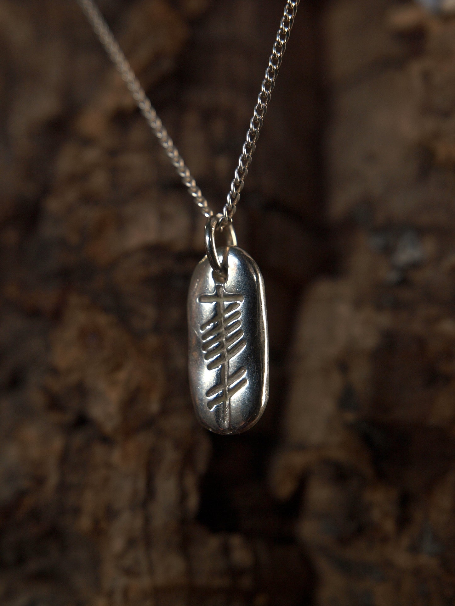 Love (carved silver pendant)