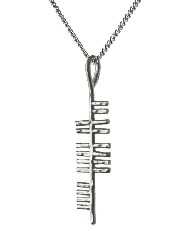 Music silver pendant on white background