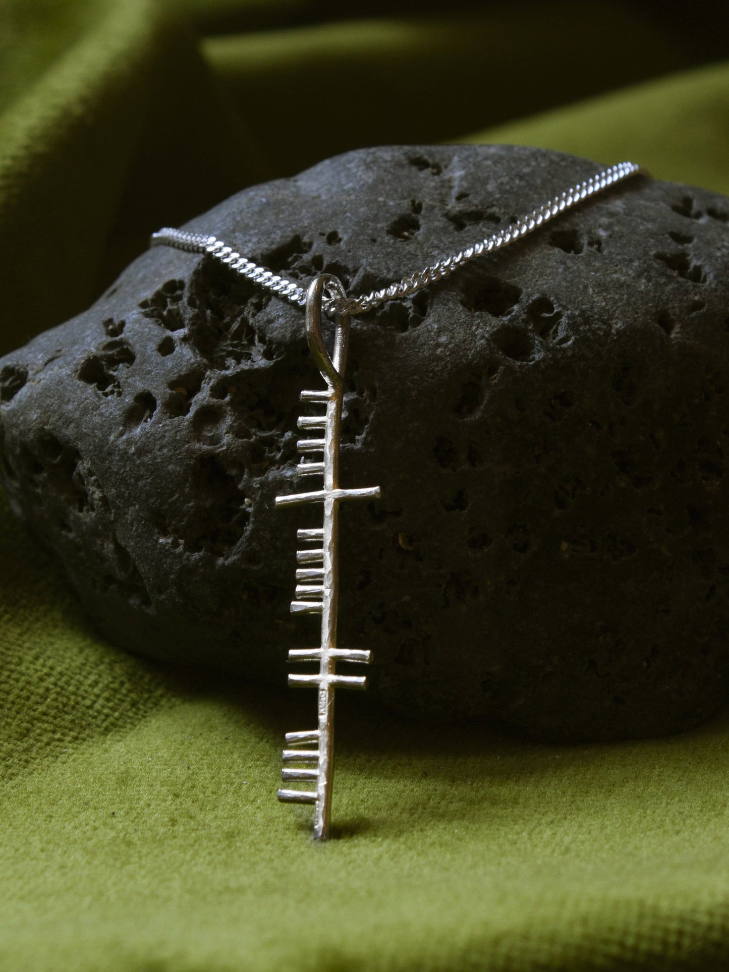Happiness silver pendant on a black stone